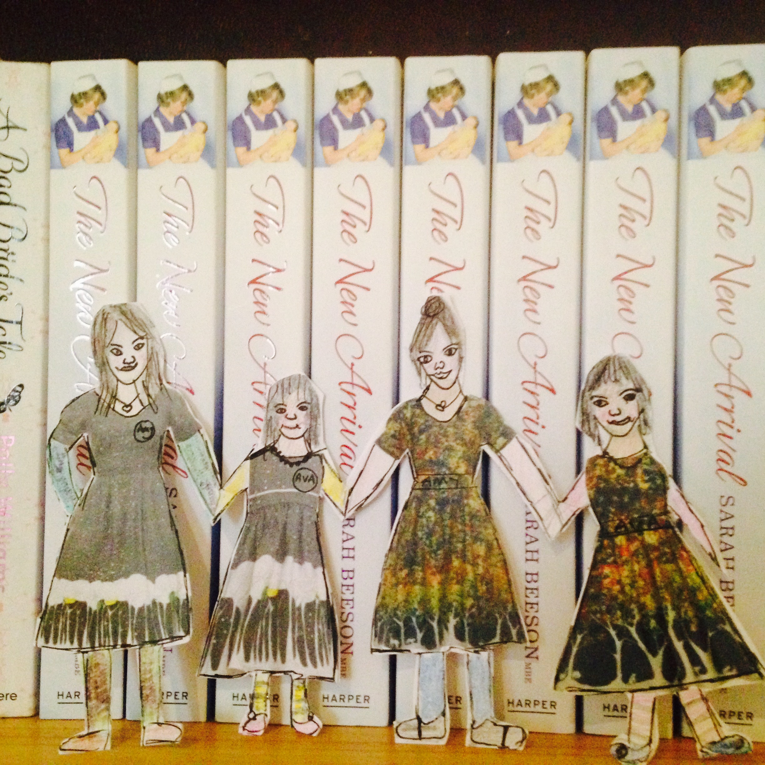 Poppy England Dolls on the bookcase